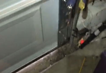 Misaligned garage door safety sensor causing malfunction in Sunnyvale, CA home